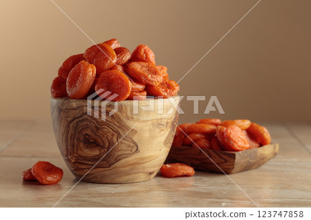Organic dried apricots on a beige background with copy space. Organic dried apricots on a beige background with copy space. 123747858