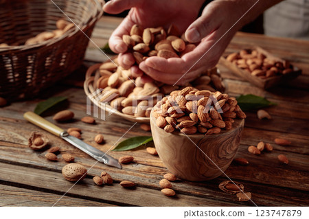 Almond nuts on a wooden table. 123747879