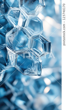 Intricate geometric shapes form a unique pattern of blue ice crystals shimmering in light 123748170