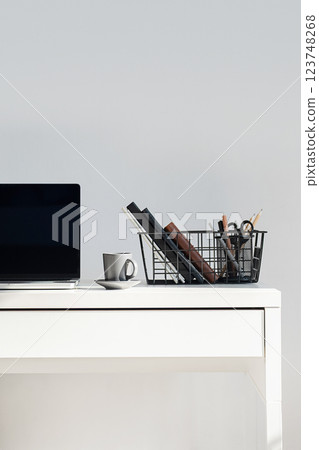 Laptop With Coffee Cup On White Desk. Laptop With Coffee Cup On White Desk. 123748268