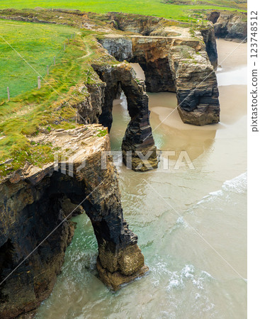 Natural rock arches Cathedrals beach, Playa de las Catedrales at Ribadeo, Galicia, Spain Natural rock arches Cathedrals beach, Playa de las Catedrales at Ribadeo, Galicia, Spain 123748512