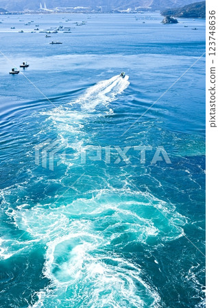 Ships sailing through the Naruto Strait 123748636