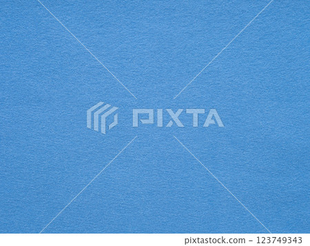 A serene expanse of rich azure, this textured felt surface evokes a sense of calm and simplicity 123749343