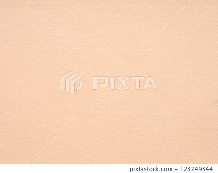 Subtle peach-toned felt texture creating a soft, serene, and minimalist visual appeal 123749344