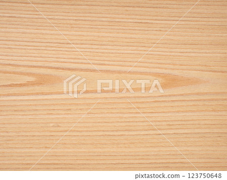 Gentle waves of honey and subtle amber flow through the fine-grained texture of this ash wood veneer Gentle waves of honey and subtle amber flow through the fine-grained texture of this ash wood veneer 123750648