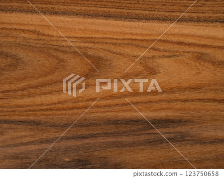 Rich, textured santos rosewood or palisander wooden surface showcasing natural patterns and warm tones 123750658