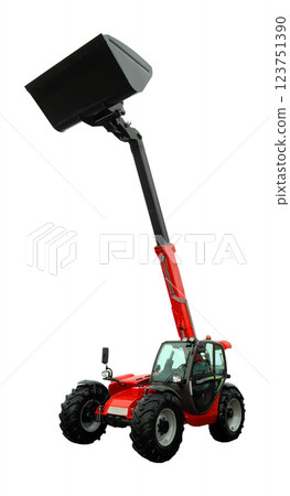 A telescopic handler is actively lifting a large bucket, showcasing its capabilities in an agricultural setting. The equipment is designed to assist with various farming tasks efficiently. 123751390