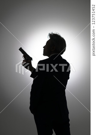 Man holding a gun Man holding a gun 123751452