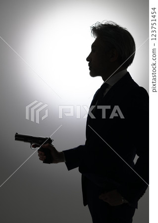 Man holding a gun Man holding a gun 123751454
