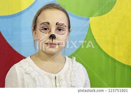 Child girl with creative carnival makeup is smling 123751801