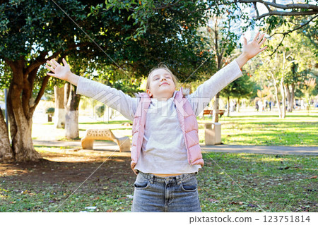 Carefree young girl walking outdoors. Portrait of child 10 years old Carefree young girl walking outdoors. Portrait of child 10 years old 123751814
