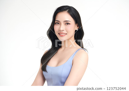 A beautiful young Asian woman with clean, fresh skin against a white background. She represents beauty, skincare, and spa treatments. A beautiful young Asian woman with clean, fresh skin against a white background. She represents beauty, skincare, and spa treatments. 123752044