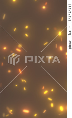 Abstract background with glowing orange and yellow particles resembling sparks or embers. Warm-toned, blurred effect creating a soft glowing atmosphere 123752341