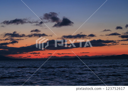 Kunashiri Island shining in the morning glow (taken from off the coast of Rausu) 123752617