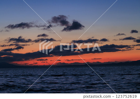 Kunashiri Island shining in the morning glow (taken from off the coast of Rausu) 123752619