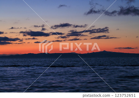 Kunashiri Island shining in the morning glow (taken from off the coast of Rausu) 123752651