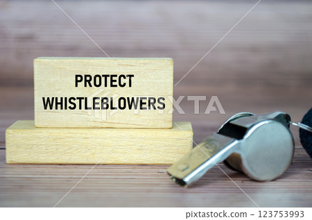 Protect Whistleblowers text on wooden blocks with whistle background Protect Whistleblowers text on wooden blocks with whistle background 123753993