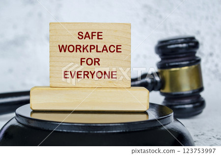 Safe workplace for everyone text written on wooden board with lawyer gavel background. Harassment concept. 123753997