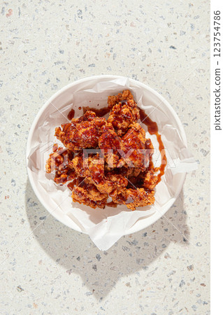 Crispy fried chicken thighs with red sauce 123754786
