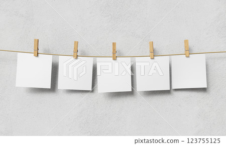 Blank Paper Hanging on Clothesline. Mock up. 3D Rendering Blank Paper Hanging on Clothesline. Mock up. 3D Rendering 123755125