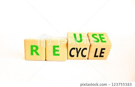 Reuse or recycle symbol. Concept words Reuse Recycle on wooden block. Beautiful white table white background. Business reuse or recycle concept. Copy space. Reuse or recycle symbol. Concept words Reuse Recycle on wooden block. Beautiful white table white background. Business reuse or recycle concept. Copy space. 123755383