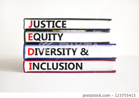 Justice equity diversity inclusion symbol. Concept words JEDI Justice Equity Diversity Inclusion on books. Beautiful white background. Business justice equity diversity inclusion concept. Copy space 123755415