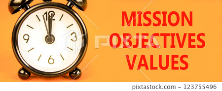 Mission objectives values symbol. Concept words Mission Objectives Values on beautiful orange paper. Beautiful orange background. Alarm clock. Business mission objectives values concept. Copy space. Mission objectives values symbol. Concept words Mission Objectives Values on beautiful orange paper. Beautiful orange background. Alarm clock. Business mission objectives values concept. Copy space. 123755496