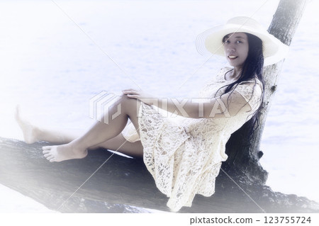 Indonesian girl in a dress and hat 123755724