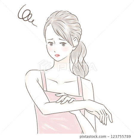A woman in a camisole with a troubled look on her face touching her tanned arms, ponytail A woman in a camisole with a troubled look on her face touching her tanned arms, ponytail 123755789