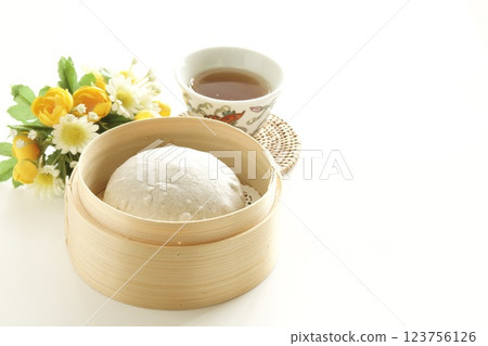 Black sesame buns in a steamer Black sesame buns in a steamer 123756126