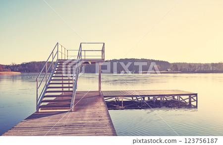 A pier on Barlinek Lake, color toning applied, Poland. 123756187