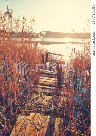 An old fishing platform on Barlinek Lake, color toning applied, Poland. An old fishing platform on Barlinek Lake, color toning applied, Poland. 123756190
