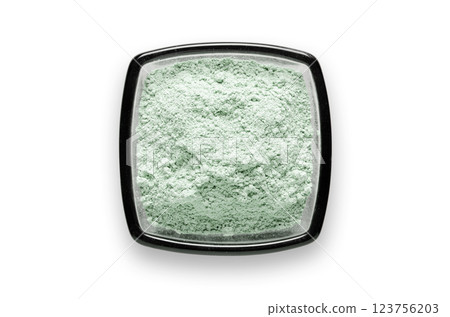Cosmetic clay for a face mask in a bowl. Isolated on a white background. Cosmetic clay for a face mask in a bowl. Isolated on a white background. 123756203
