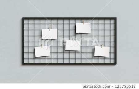 Blank Paper Hanging on Metal Grid Board with Wooden Clip Mock up. 3D Rendering 123756512