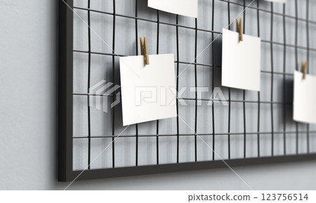 Blank Paper Hanging on Metal Grid Board with Wooden Clip Mock up. 3D Rendering Blank Paper Hanging on Metal Grid Board with Wooden Clip Mock up. 3D Rendering 123756514