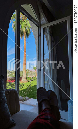 Female 's feet relaxing on the bed with luxury room Female 's feet relaxing on the bed with luxury room 123756675