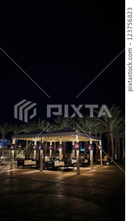 Night view of an Egyptian hotel restaurant with illuminated gazebos 123756823