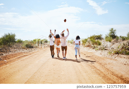 Summer, adventure and friends walking on dirt road in the country, throwing ball in air. Travel, freedom and young group of men and women on holiday together to explore nature, vacation and blue sky Summer, adventure and friends walking on dirt road in the country, throwing ball in air. Travel, freedom and young group of men and women on holiday together to explore nature, vacation and blue sky 123757959