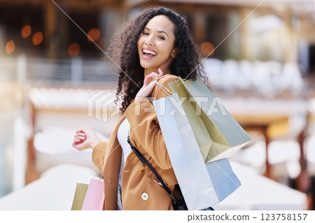 Shopping, happy and portrait of customer with bag after shopping spree buying retail fashion product on store discount. Sales, smile and young black woman at luxury shopping mall to purchase clothes 123758157