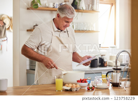 Cooking, recipe and senior man with a video online for breakfast in the kitchen of his house. Elderly man reading information about food for healthy and vegan lunch on the internet with a tablet Cooking, recipe and senior man with a video online for breakfast in the kitchen of his house. Elderly man reading information about food for healthy and vegan lunch on the internet with a tablet 123758229