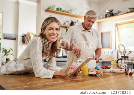 Cooking, tablet and senior couple reading information about food for breakfast on internet in the kitchen. Portrait of an elderly man and woman with digital video recipe on tech for lunch or dinner 123758233