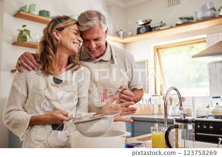 Cooking, love and food with a senior couple baking in the kitchen of their retirement home together. Romance, affection and bake with an elderly man and woman pensioner preparing a meal in the house Cooking, love and food with a senior couple baking in the kitchen of their retirement home together. Romance, affection and bake with an elderly man and woman pensioner preparing a meal in the house 123758269