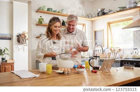 Couple, love and baking with a senior man and woman cooking in the kitchen of the retirement home together. Food, happy and bake with an elderly male and female pensioner preparing a meal in a house Couple, love and baking with a senior man and woman cooking in the kitchen of the retirement home together. Food, happy and bake with an elderly male and female pensioner preparing a meal in a house 123758315