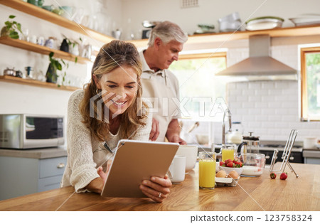 Woman, tablet and old couple in home kitchen on social media, internet surfing or reading news. Retirement, elderly husband and wife in house with 5g mobile and streaming web content on digital tech. Woman, tablet and old couple in home kitchen on social media, internet surfing or reading news. Retirement, elderly husband and wife in house with 5g mobile and streaming web content on digital tech. 123758324
