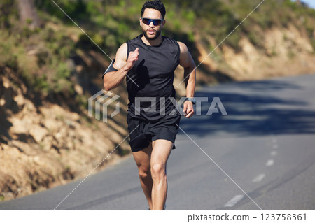 Fitness, workout and man running on road for health, exercise and sports marathon. Challenge, freedom and training with athlete runner in street for wellness, achievement and cardio in outdoor Fitness, workout and man running on road for health, exercise and sports marathon. Challenge, freedom and training with athlete runner in street for wellness, achievement and cardio in outdoor 123758361