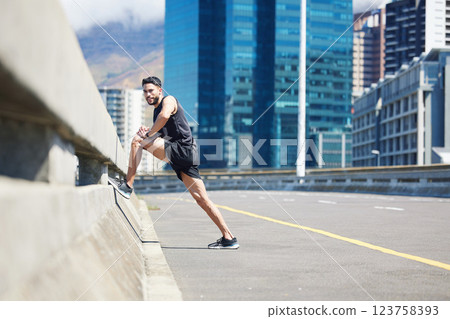 Fitness, exercise and stretching with a sports man or runner warming for a training workout in the city. Running, health and wellness with a male athlete at the start of his performance routine 123758393