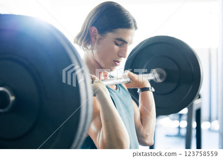 Strong, gym and fitness of a man with barbell for muscle workout, bodybuilder training or challenge exercise with health or wellness goal. Sports weightlifting person with focus, power and motivation Strong, gym and fitness of a man with barbell for muscle workout, bodybuilder training or challenge exercise with health or wellness goal. Sports weightlifting person with focus, power and motivation 123758559