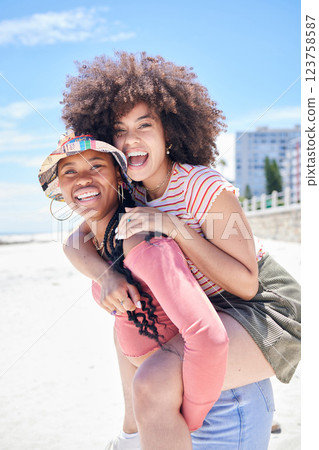 Friends, gay and lesbian with women happy on piggyback and fun at beach in summer. LGBTQ, dating and trust with happy female and her girlfriend on holiday, vacation or travel by the coast in summer Friends, gay and lesbian with women happy on piggyback and fun at beach in summer. LGBTQ, dating and trust with happy female and her girlfriend on holiday, vacation or travel by the coast in summer 123758587
