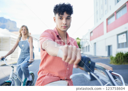 Bike, travel and friends with a man and woman riding a bicycle together in the city during summer. Sport, cycling and carbon footprint with a young male and female friend biking in an urban town Bike, travel and friends with a man and woman riding a bicycle together in the city during summer. Sport, cycling and carbon footprint with a young male and female friend biking in an urban town 123758604