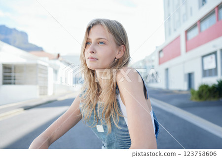 Thinking, vision and girl in the street in city, sitting on the road in trendy outfit. Creative, inspiration and ideas for future in young student on floor in urban town, innovation in youth mockup 123758606